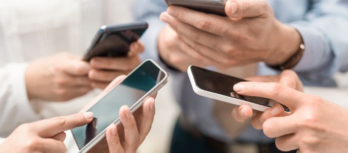 people in a circle using their cell phones